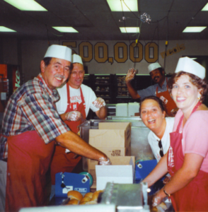 Volunteers prepare meals for those affected by HIV/AIDS.